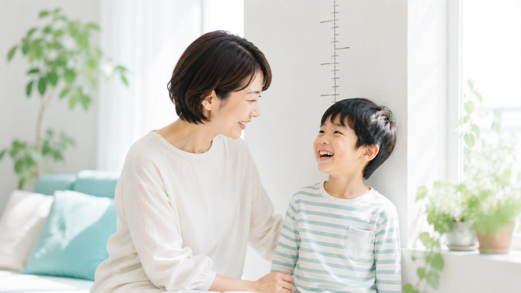 身長の成長を喜ぶ親子